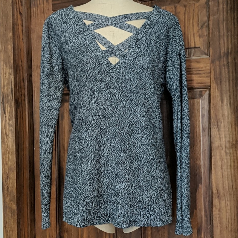 Tunic sweater with cross cross neck.